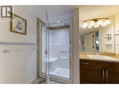 Separate shower with seat up at 2142 Vasile Road Unit# #409, Springfield/Spall, Kelowna