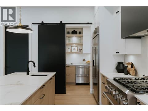 Spacious walk in pantry with additional refrigerator drawers and cabinetry at 5533 Foothill Court, Kettle Valley, Kelowna