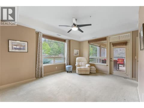 Large king-sized primary bedroom with direct access to the deck. at 2780 Auburn Road Unit# 203, Shannon Lake, West Kelowna