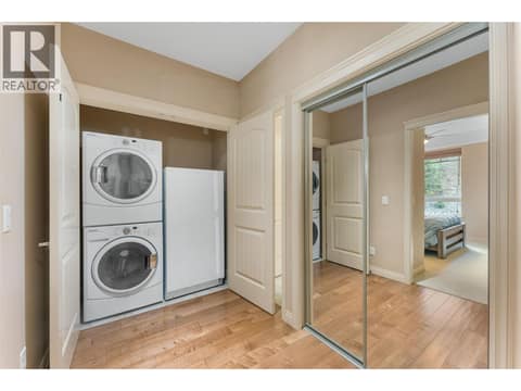 Stacked in-unit laundry plus an included upright freezer. at 2780 Auburn Road Unit# 203, Shannon Lake, West Kelowna