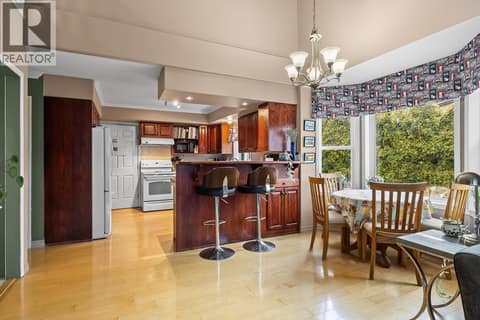 Kitchen and breakfast nook at 3219 Sagebrush Court, Shannon Lake, West Kelowna