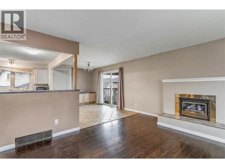 Living Room looking into Dining Room/ Kitchen at 758 Josselyn Court, Rutland North, Kelowna
