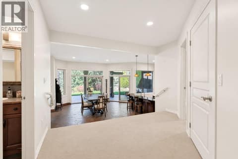 Landing Down to Bathroom/Living/ Kitchen/Dining Down at 1950 Capistrano Drive Unit# 108, University District, Kelowna