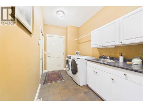 Laundry to Garage at 1950 Capistrano Drive Unit# 108, University District, Kelowna