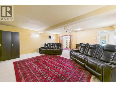 Media Room to Wine Cellar at 1950 Capistrano Drive Unit# 108, University District, Kelowna