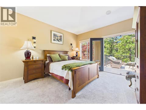Primary Bedroom with Doors to Deck at 1950 Capistrano Drive Unit# 108, University District, Kelowna