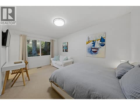 Bedroom with half bath ensuite at 5147 Lakeshore Road, Upper Mission, Kelowna