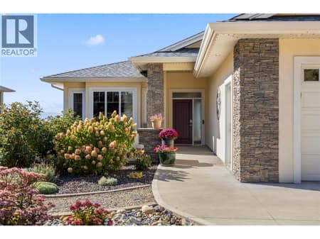 Gorgeous curb appeal with a low maintenance front yard and courtyard with garden beds at 2442 Bella Vista Street, Black Mountain, Kelowna