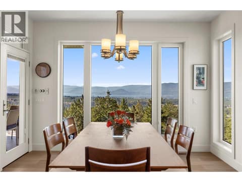 Lake and mountain views from the dinner table at 2442 Bella Vista Street, Black Mountain, Kelowna