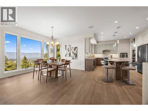 Living room opens up to the dining room and kitchen at 2442 Bella Vista Street, Black Mountain, Kelowna