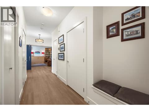 Mudroom with built in bench and multiple closets at 2442 Bella Vista Street, Black Mountain, Kelowna