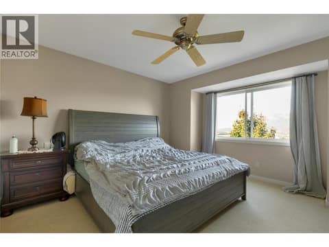 Primary bedroom with large windows and views at 110 Red Rock Crescent, Enderby / Grindrod