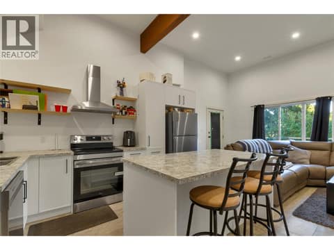 Suite open concept kitchen/dining/living room with 12' ceilings at 110 Red Rock Crescent, Enderby / Grindrod