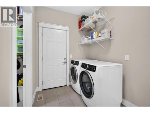 Main floor laundry at 2425 Tallus Heights Drive, Shannon Lake, West Kelowna