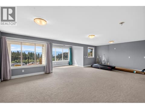 Rec room. Walk out to patio at 2425 Tallus Heights Drive, Shannon Lake, West Kelowna