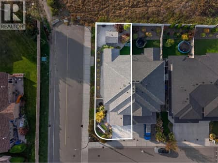 Desirable end-unit location with double garage, ample parking, and a private, fully fenced backyard. at 2400 Hawks Boulevard, Westbank Centre, West Kelowna