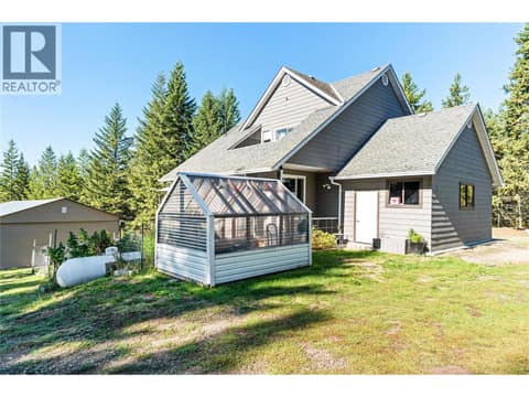 Side View with Garden / Greenhouse Main Home at 59 Rawlings Lake Road, Lumby Valley
