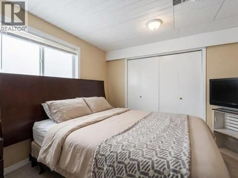 Suite Bedroom 1, virtually staged. at 3368 McIver Road, Glenrosa, West Kelowna