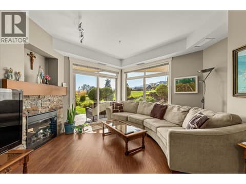 High ceilings and picture windows are all about the Views.. at 3545 Carrington Road Unit# 108, Westbank Centre, West Kelowna