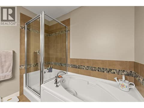 Soaker tub and separate shower. at 3545 Carrington Road Unit# 108, Westbank Centre, West Kelowna