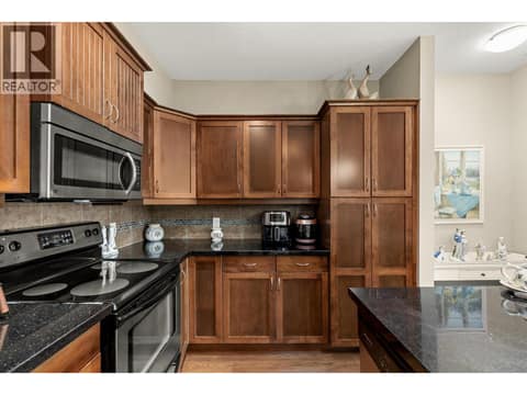 Tons of cupboards and a pantry. at 3545 Carrington Road Unit# 108, Westbank Centre, West Kelowna