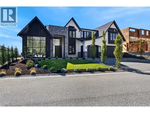 Finished with striking Shou Sugi Ban burnt wood siding and Pangaea Stone. Impressive curb appeal with striking modern architecture, beautiful landscaping, oversized driveway and a triple car garage. at 1531 Cabernet Way, Lakeview Heights, West Kelowna