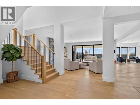 Grand open entry showcasing soaring ceilings, natural light and seamless flow into the main living spaces. at 1531 Cabernet Way, Lakeview Heights, West Kelowna