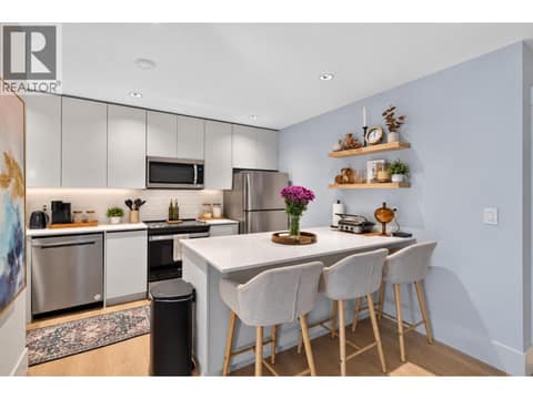 Self contained 1 bedroom legal suite with modern kitchen and island seating. at 1531 Cabernet Way, Lakeview Heights, West Kelowna