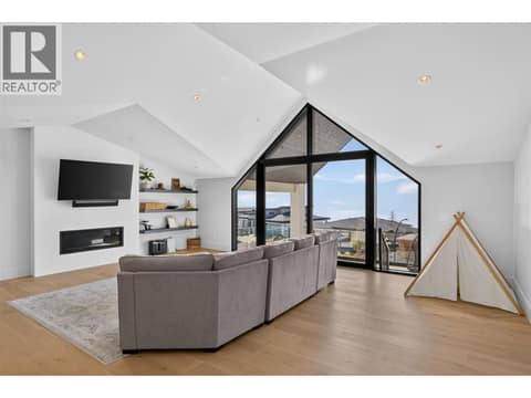 Spectacular lake view lounge with dramatic vaulted ceilings, wet bar and covered view deck. at 1531 Cabernet Way, Lakeview Heights, West Kelowna