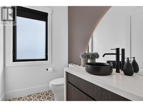 Stylish powder room with modern finishes and statement lighting. at 1531 Cabernet Way, Lakeview Heights, West Kelowna