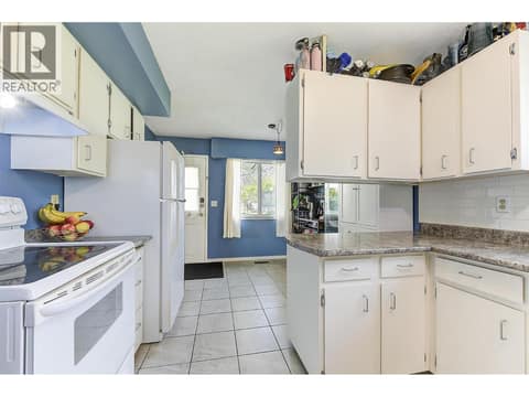 Left side kitchen at 1360 Elm Street, Glenmore, Kelowna