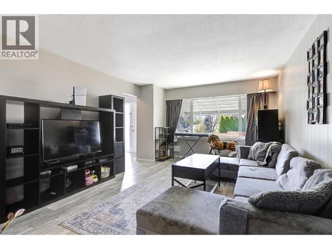 Left side living room at 1360 Elm Street, Glenmore, Kelowna