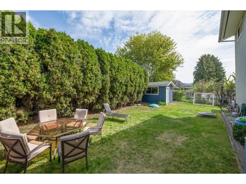 Left side view at 1360 Elm Street, Glenmore, Kelowna