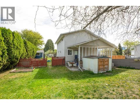 Left side yard at 1360 Elm Street, Glenmore, Kelowna