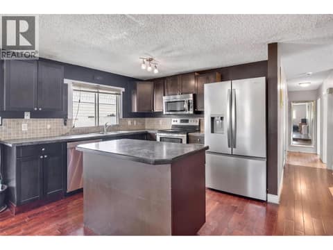 The kitchen has been virtually decluttered for presentation purposes. at 1311 25TH Avenue, East Hill, Vernon