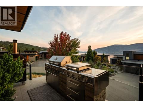 BBQ area at twilight at 1666 Lakestone Drive, Lake Country South West