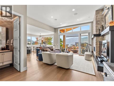 Entering the Living room w/ powder room to the left at 1666 Lakestone Drive, Lake Country South West