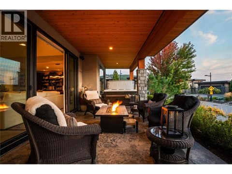 Lower Level patio to Hot Tub at twilight at 1666 Lakestone Drive, Lake Country South West