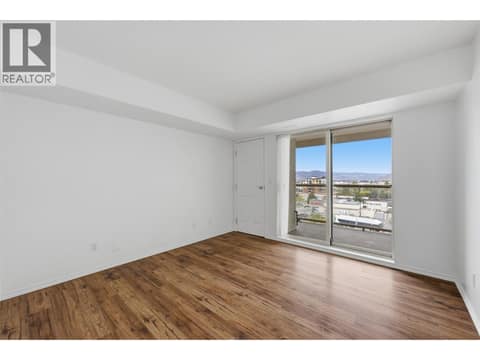 Primary bedroom with balcony access at 629 Lansdowne Street Unit# 505, South Kamloops