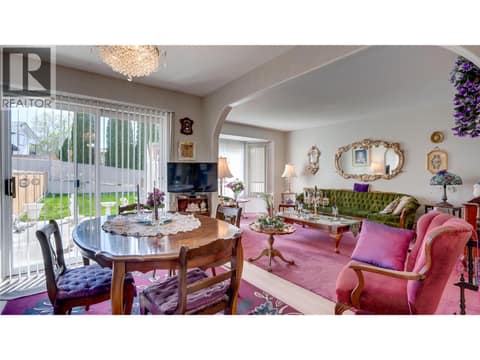 Dining room to patio sliders. at 3906 Pleasant Valley Road Unit# 23, Harwood, Vernon