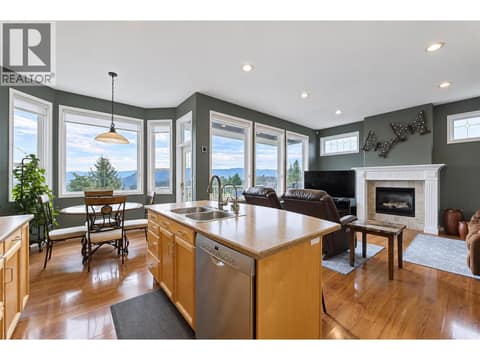 Kitchen to nook, access to deck and family room at 2280 Shannon Hills Drive, Shannon Lake, West Kelowna