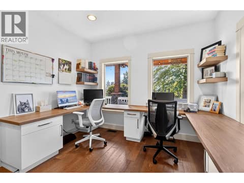Bright home office with custom built in desk, cabinetry and feature accent wall. at 178 Terrace Hill Court, Wilden, Kelowna
