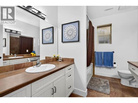 Full bathroom with heated floors in basement. at 178 Terrace Hill Court, Wilden, Kelowna