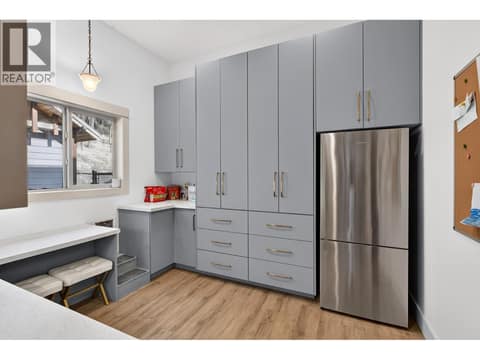 Oversized walk in pantry with extensive cabinetry, additional refrigerator and abundant storage. Previously used as a second kitchen. at 178 Terrace Hill Court, Wilden, Kelowna