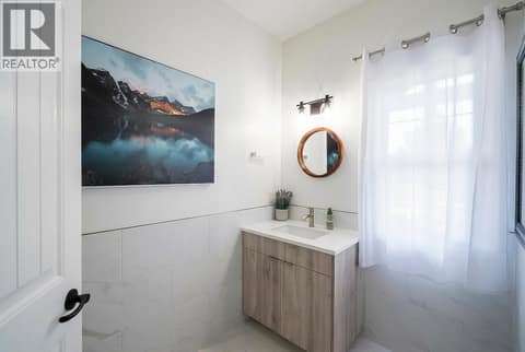 Powder room with heated floors on main level. at 178 Terrace Hill Court, Wilden, Kelowna