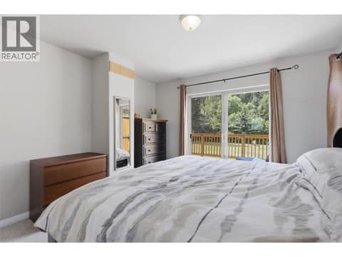 Main Floor Primary Bedroom at 7153 CAHILTY Road, Heffley, Kamloops