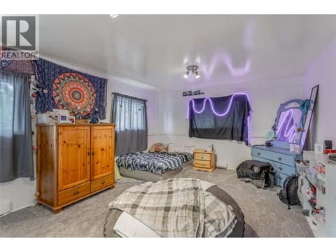 Bonus room above the garage currently used as a bedroom. at 3341 Webber Road, Glenrosa, West Kelowna