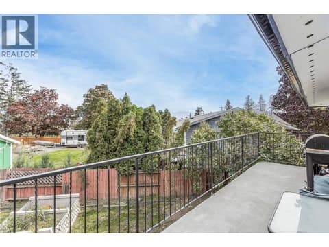 Fenced backyard with fruit trees and room for a garden at 3341 Webber Road, Glenrosa, West Kelowna
