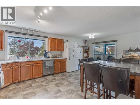 Large kitchen with lots of storage and counter space. Great light looking out to the backyard. Sliding door leading to the deck and the bonus room over the garage. at 3341 Webber Road, Glenrosa, West Kelowna