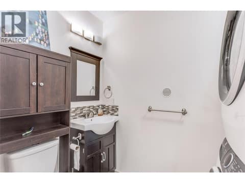 Lower-level powder room and laundry. at 3341 Webber Road, Glenrosa, West Kelowna